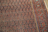 Antique Malayer carpet: repeating boteh design, geometric border in blush, sky blue, and charcoal.