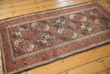 Intricate diamond fills within repeating gul motifs and water channel border, in rich madder and blue, showing wear.