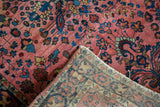 Hand-knotted foundation and low floral pile of the vintage Mohajeran Sarouk rug.