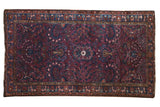 Vintage Lilihan rug, deep raspberry field, blue medallion with allover floral vinery, low pile.