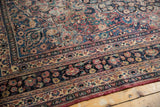 Persian Meshed carpet borders showcasing floral vinery and palmettes in softened gem tones.
