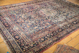 Hand knotted Persian Meshed carpet with allover floral palmettes and borders in muted tones.