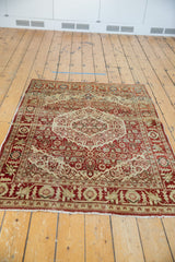 Vintage Persian Tabriz rug with a serrated concentric medallion in terra cotta rust and sand.