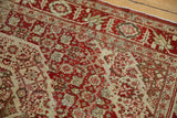 Detailed view of a vintage Tabriz rug with color abrashes across the low-pile geometric design.