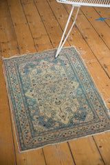 Detailed corner of an Antique Haji Jalili Tabriz rug, revealing dusty teal borders, aged patina, and tattered edges.
