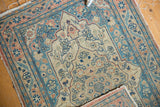 Antique Haji Jalili Tabriz mat corner with hand-knotted foundation, fringed edge, and aged patina.