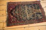 Vintage Kerman rug with intricate Persian border, abrash striations, and low pile.