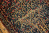 Vintage Kerman rug detail, abrash striations on tree of life design with raspberry and indigo.