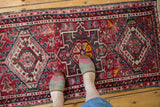 Vintage hand knotted Karaja runner with geometric medallions, floral patterns, and low pile.