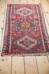 Low pile of the vintage Karaja runner showcasing geometric motifs on cherry red.