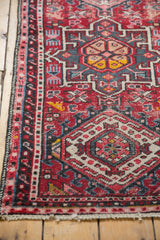 Vintage Karaja runner detail: low pile, knot heads, red field, geometric patterns, and fringe.