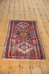 Textured cherry red Karaja rug runner featuring geometric diamond motifs and side binding.