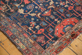 Serrated serpent and boteh motifs on vintage Hamadan rug corner, madder red and navy.