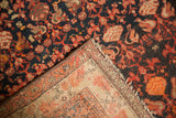 Vintage Malayer rug corner: allover navy floral pile, secure side, and woven foundation.