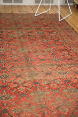Textured antique Beshir carpet pile, red and navy lattice design, extensive wear exposing foundation.