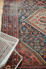 Detail of vintage Mahal rug with diamond medallion corner, intricate field patterns, and aged pile.