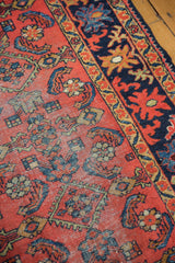 Low pile cherry red Lilihan rug field displays cobalt blue Herati motifs.