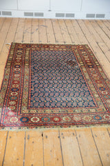Secure hand-knotted fringe and colorful floral main border of the vintage Persian rug.