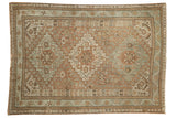 Vintage distressed Shiraz rug with triple medallion geometric design in softened copper, seafoam, ivory.