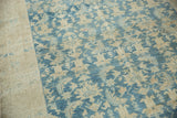 Malayer runner's worn Herati pattern and soft blue field with exposed beige foundation.