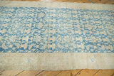 Visible texture of distressed Malayer runner's blue abrashed field, stylized Herati motif.