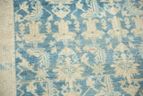 Distressed vintage Malayer rug pile texture, with stylized Herati motif in soft blue and beige.
