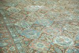 Distressed Baktiari carpet, Gardens of Paradise motif with softened pile in terracotta, teal, blush.