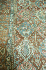 Distressed vintage Baktiari carpet detail: Gardens of Paradise motifs, deer, copper terracotta, blush, and slate blue.