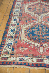 Hand-knotted Serab runner with geometric border in sky blue and camel, cherry red field.