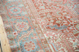 Distressed vintage Heriz carpet with rectilinear vinery and Bakshaish palmette border, red, blue-green, ivory.
