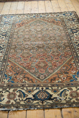 Distressed Malayer rug corner with low pile, turtle samovar border, and gentle wear.