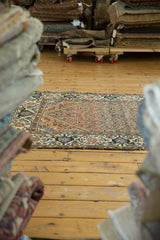 Vintage Distressed Malayer rug with allover Herati motif in rustic terracotta and navy teal.
