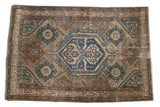 Vintage Distressed Malayer rug with hexagonal navy medallion, terracotta, teal, and beige floral motifs, 4'2