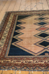 Distressed antique Malayer rug, unique zigzag diamond pattern in faded raspberry and deep navy abrasions.