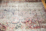 Kerman's floral arabesques and buds showing antique ivory, blush, and blue patina.