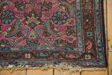 Lilihan rug corner: dark raspberry Herati motifs, sky blue, and a tattered end.