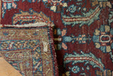 Vintage Heriz runner pile with Aubergine Herati motif, exposed hand-knotted foundation, and tattered end.