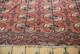 Hand-knotted Vintage Bokhara carpet end, with dusty raspberry gul motif, border, and fringe.
