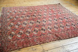 Vintage Bokhara rug detail, featuring repeating gul motifs, geometric border, and low pile.