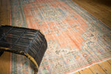 Distressed vintage Oushak carpet with peach, faded blue, and mint Rococo floral pattern.