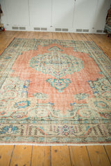 Distressed vintage Oushak rug border with mint green Rococo contour, lotus flowers, and fringe.
