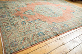 Distressed Oushak border with meandering vines, lotus flowers in mint green and terracotta.