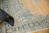 Distressed Oushak rug corner, apricot field, navy border, Rococo European stylized floral motifs.