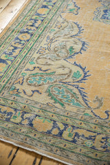 Worn knot heads and faint foundation of distressed Oushak rug, with Rococo floral motifs.