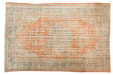 Distressed vintage Oushak carpet, scalloped terracotta medallion, ivory, ocean blue green. 7'1