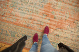 Vintage Distressed Oushak carpet's evenly worn texture in pale terracotta and ocean blue-green.