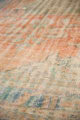 Vintage distressed Oushak rug pile showing even wear, terracotta, blue-green, ivory.