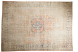 Distressed vintage Oushak carpet with rose blush medallion, faded blue vinery, and even wear, 7'9