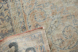 Worn, textured pile of a distressed Oushak rug, showing foundation, fringe, and reverse.