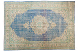 Distressed vintage Oushak carpet, scalloped roundel medallion, sky blue, and antique ivory. 7x10.